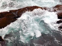 ocean surf on the rocks close up
