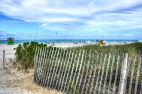 amazing south beach sand fence sky clouds