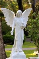 white angel sculpture in a cemetery