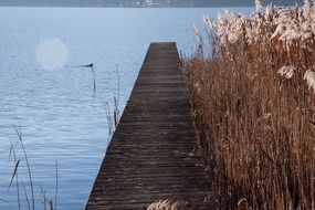 Wooden boardwalk on a lake