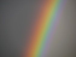 rainbow on grey sky