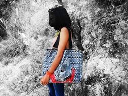 photo of a girl with a wild cat mask and bag