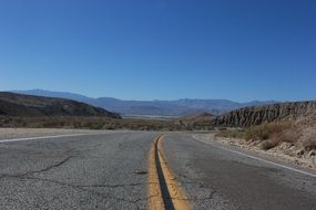 winding desert road on a sunny day