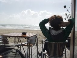 girl in a cafe on the beach