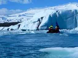 tourists on an inflatable boat in the glacial lagoon in Iceland