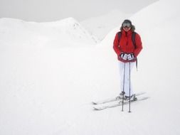 happy woman on ski at snowy peak