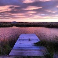 pier on the bright evening water