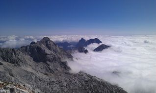 Beautiful mountain peaks in white clouds