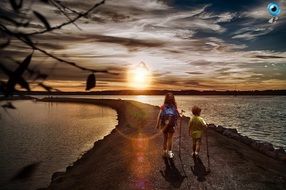 Children are walking near the water