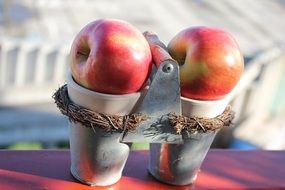 two apples in glasses