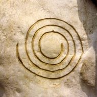 Spiral symbol on a rock