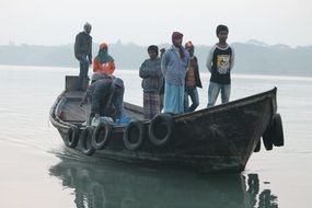 fishermen on a boat in the river