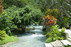 spring waterfall on river landscape