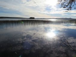 blue lake at sunrise in Finland