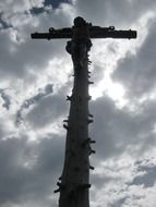 summit cross at cloudy sky