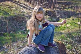 portrait of cute child with blond long hair