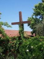 the wooden cross was covered with grass