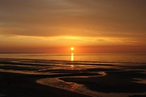 sunset over the norman beach