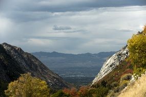 scenic mountains beneath grey clouds at fall, usa, utah