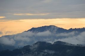 landscape of cloudy haze sky over alpine mountains