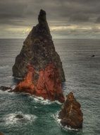 madeira cliff in dark ocean waters