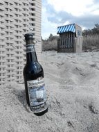 dark beer on the beach of the Baltic Sea