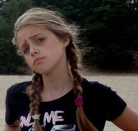 photo of a girl with two pigtails in a black T-shirt