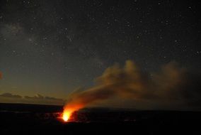 volcanic eruption at night