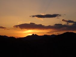 Bright sunset behind the mountain