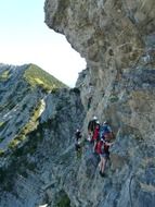 panoramic view of climbers on a rock