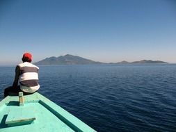 sea boat with mountain scene