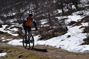 athlete is cycling in the mountains