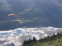 skydiver soars above the clouds in Norway