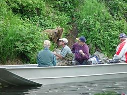 fishermen on a boat on the river