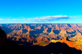 Beautiful and colorful sunset in Grand canyon in Arizona under blue sky with white clouds