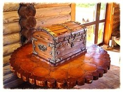 wooden carving chest on a table of natural wood