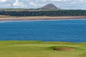 golf green field sea view