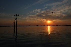 sunset mirroring at water, dusk seascape