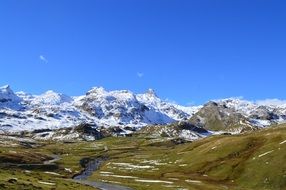 alpine mountains under blue sky