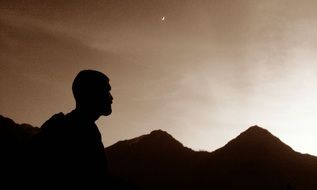 shadow of a man on a background of mountains