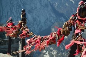ribbons and locks on a bridge in china