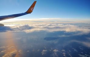 Aircraft tail on the background of clouds