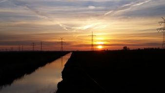 sunset on the horizon of the river bed