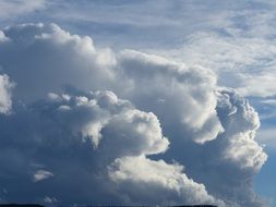 cumulus clouds on a cloudy sky