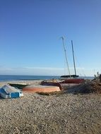 boats on pebble beach