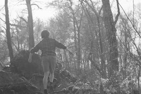 boy lost in forest black and white photo