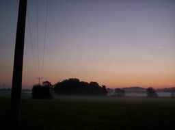 fog with sunrise on landscape