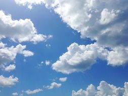 blue sky with white fluffy clouds