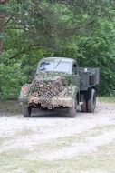 old military truck on the road