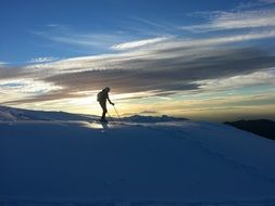 Human mountaineering on a snowy mountain peak